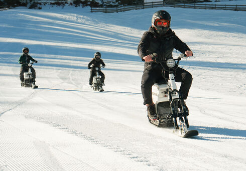 A group of friends venture out for their first moon bike ride in Achenkirch on Lake Achensee.