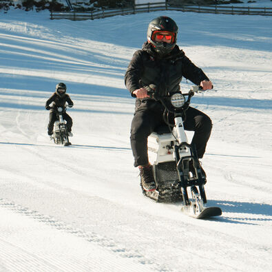A group of friends venture out for their first moon bike ride in Achenkirch on Lake Achensee.
