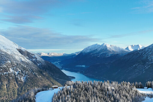 The landscape at Lake Achensee, when it is already spring-like in the valley and the peaks are covered in snow.