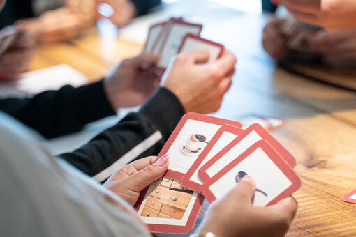 A group in a German course learns with picture cards.