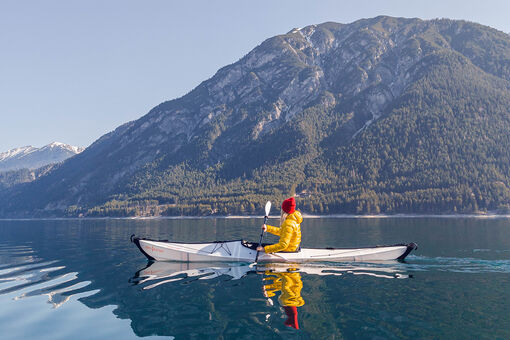 Kayaking on Lake Achensee is an excellent way to experience the stillness of spring.