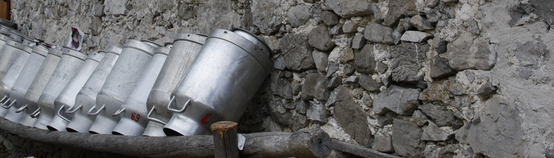 Falzturnalm in the Nature Park Karwendel This photo captures large milk cans in front of the mountain hut in the Falzthurntal.