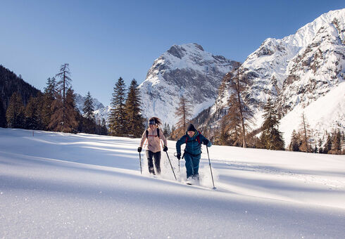 Explore the wintry scenery of the Falzturnthal in the Nature Park Karwendel on snowshoes.