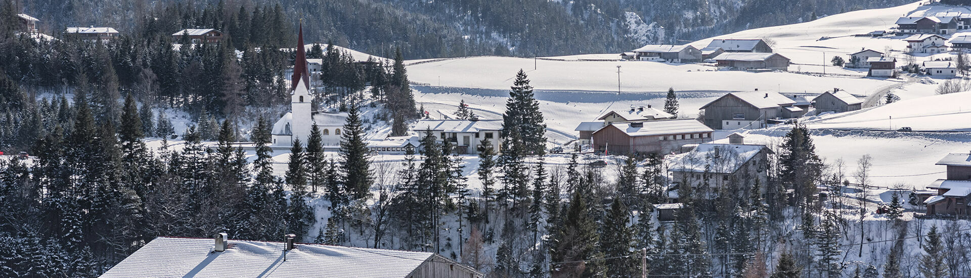 Winter view of Steinberg am Rofan, in the foreground of this photo is the Müggerhof.