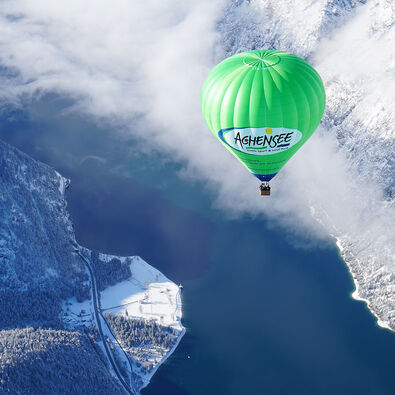Rise into the skies in hot-air balloon and enjoy a bird's eye view of the wintry Karwendel mountains.
