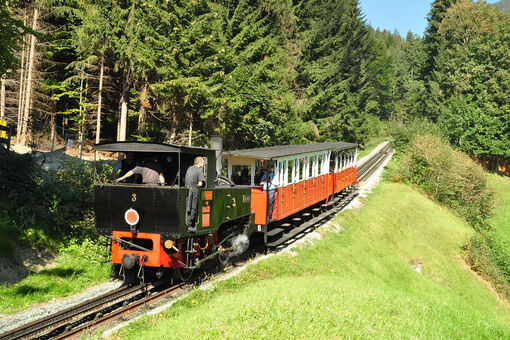 Enjoying a scenic ride from Jenbach to Seespitz on Europe's oldest steam cog railway.