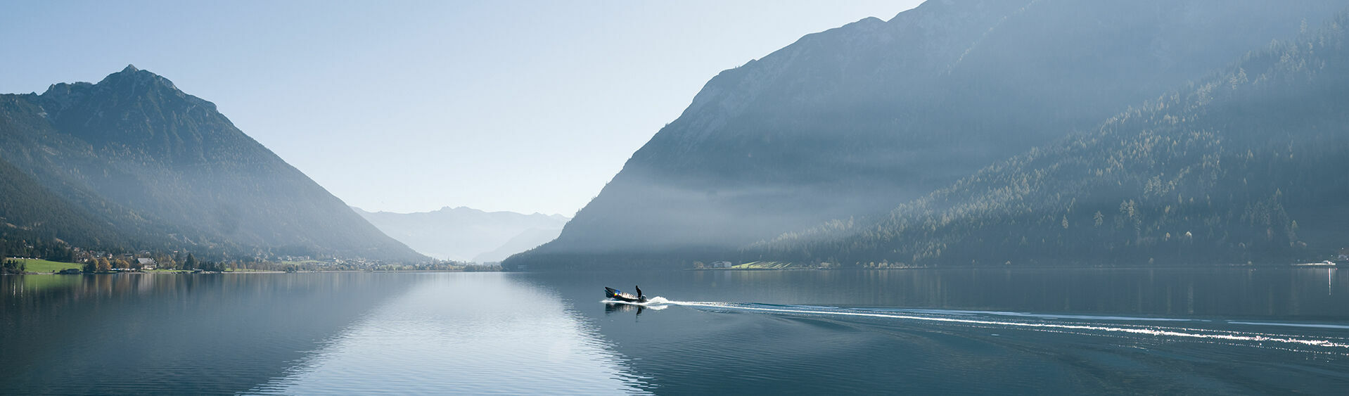 Early risers enjoying a boat tour on Lake Achensee.