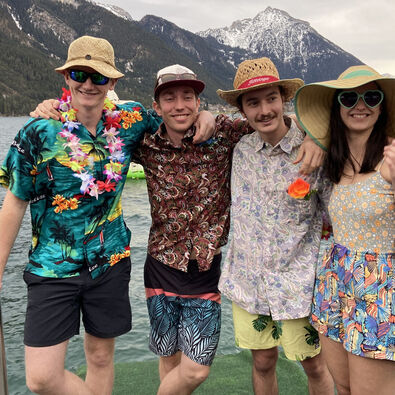 Participants of the New Year's eve swim receive a splash of ice-cold water before braving the freezing cold water of Lake Achensee.
