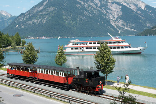 The launch of the Achenseeschiffahrt and the steam cog railway marked the beginning of tourism at Lake Achensee.