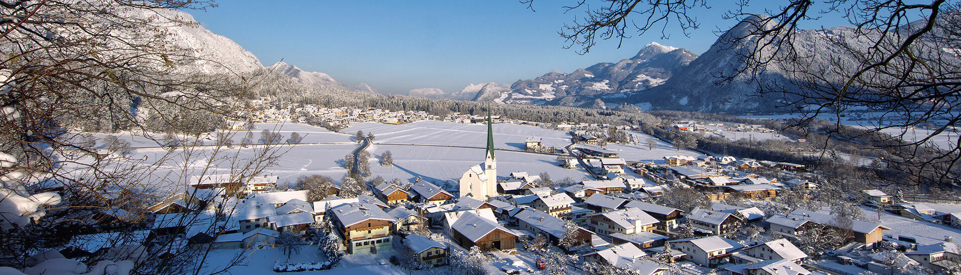 Winter shot of Wiesing featuring the parish church. The village of Wiesing lies in the Inntal valley at the foot of the Achensee region.