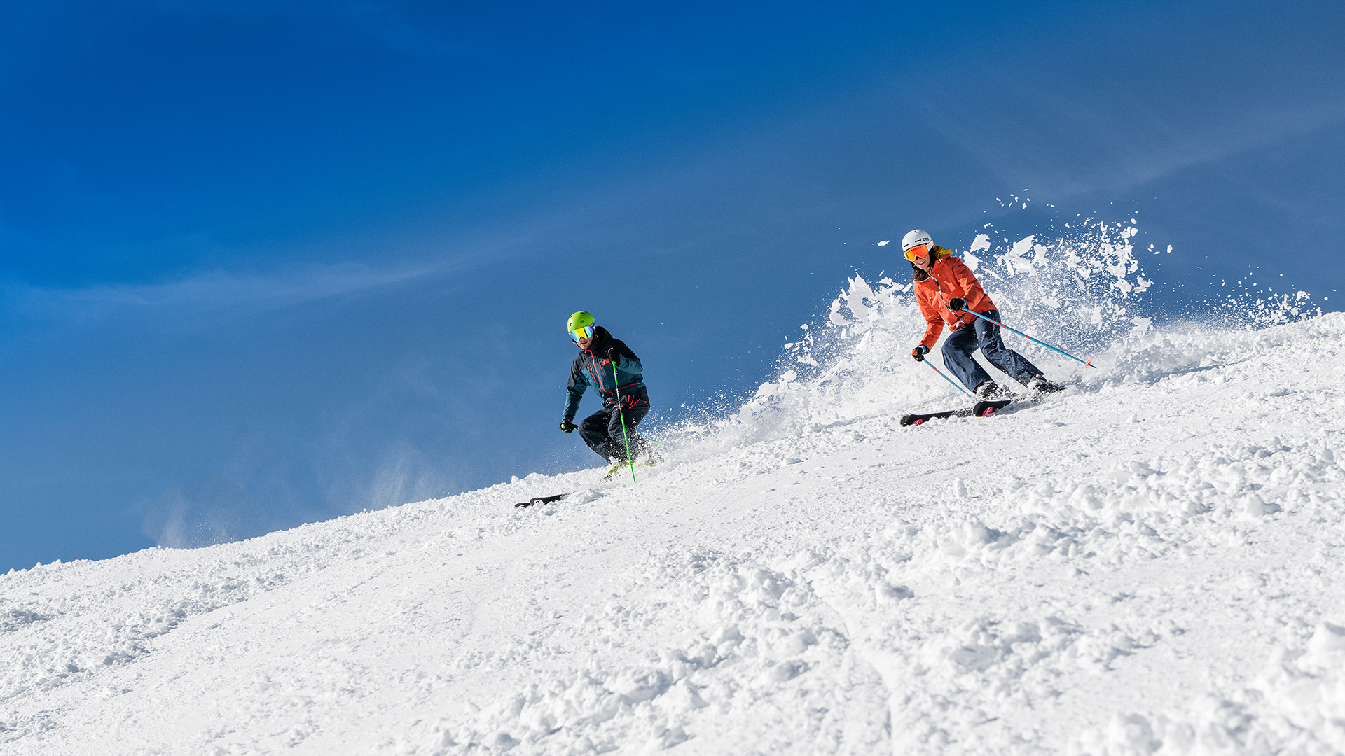 Downhill skiing in Achenkirch am Achensee In the ski area Christlum in Achenkirch skiers enjoy the sun and the view of Lake Achensee and its surrounding mountains.