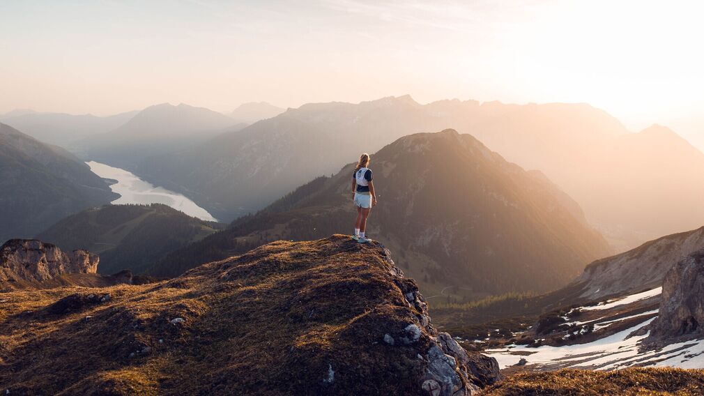 Sunrise in May from the Bärenkopf summit with views of Lake Achensee and the surrounding mountains.