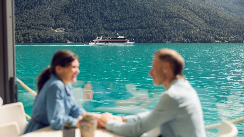 Cocktail at SeeBar on the lakeside promenade in Pertisau, right on the shores of Lake Achensee.