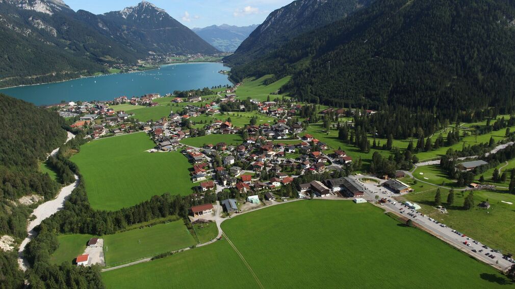 Mystical morning mood in autumn - toll road in the Karwendel valleys in Pertisau - entrance of the Nature Park Karwendel
